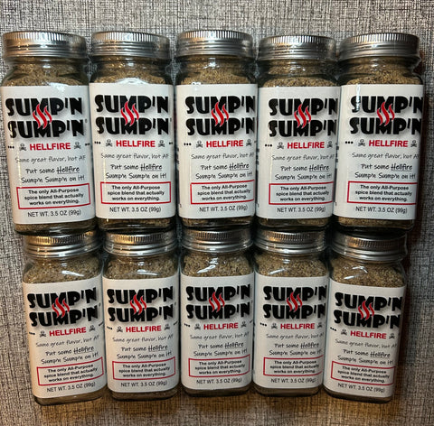 Multiple jars of Sumpin' Sumpin' Hellfire spice blend on a textured surface